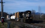 The NS yard job, E23, returns from its interchange duties with CSX with four cars this trip.  Woman and (wo)man's best friend takes a picture on the left.  The Langley Fountain sprays skyward to the right.